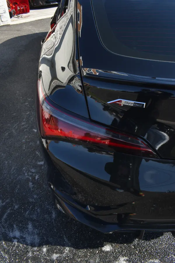 Acura Integra A-Spec taillight and badge after the wash