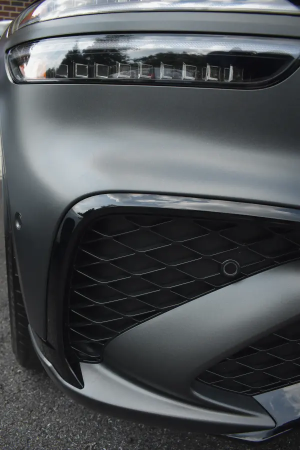 Matte grey Genesis front bumper and grille, detailed